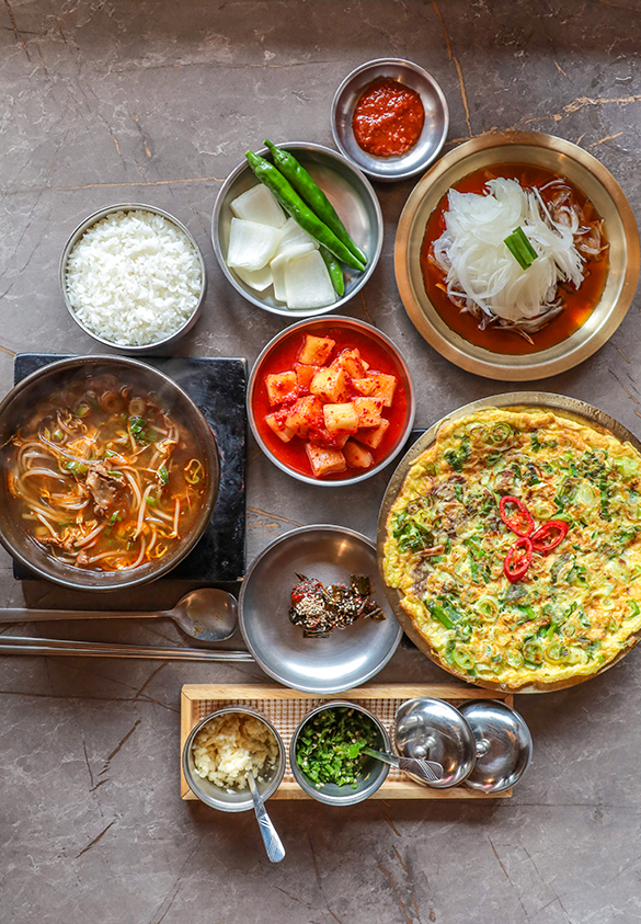 Goyu Hanwoo Gukbap breakfast table with beef soup and yukjeon